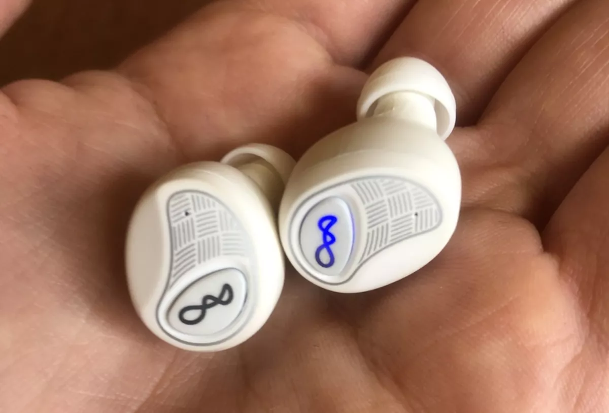 Close up of earbuds - LED indicator on